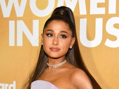 Ariana Grande posing in lavender dress at the Women in Music Awards.  