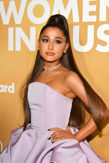 Ariana Grande posing in lavender dress at the Women in Music Awards.  