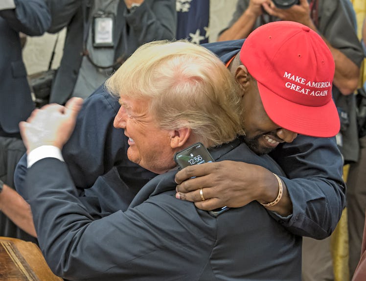 Kanye West hugs Donald Trump.
