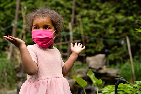 little girl in face mask