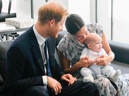Prince Harry and Meghan Markle laugh with son Archie.