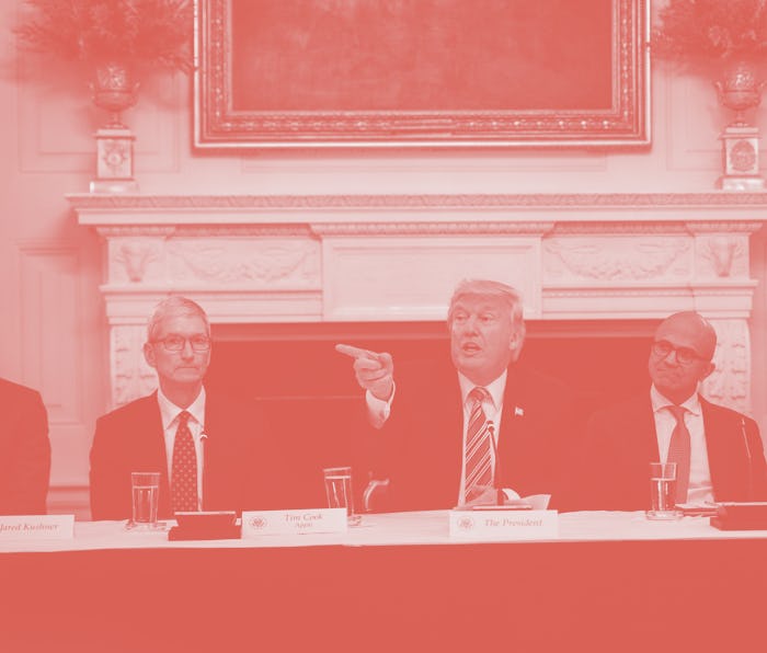 Trump sits at a long table with the CEOs of Apple, Microsoft, and Amazon.