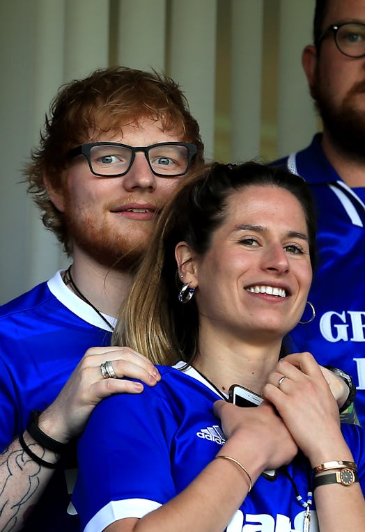 Ed Sheeran and wife Cherry Seaborn attend a sports game.
