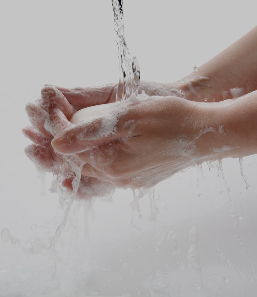 A person washing their hands