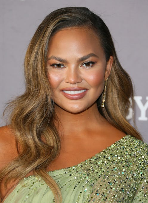 Chrissy Teigen found out about her pregnancy after her breast implant surgery.