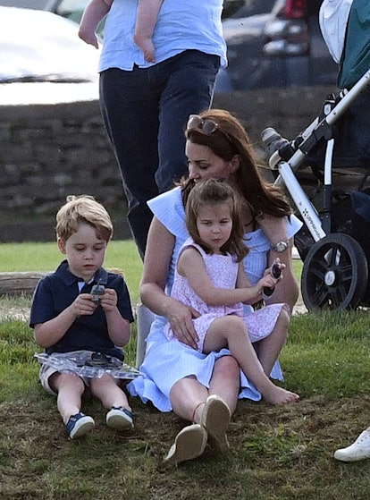 Princess Charlotte reclaims her mom's lap.