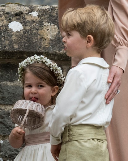 Princess Charlotte licks a basket at the 2017 wedding of Pippa Middleton.