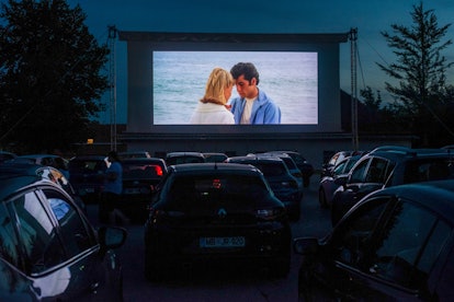 A bunch of cars line up at a drive-in theater to watch 'Grease.'