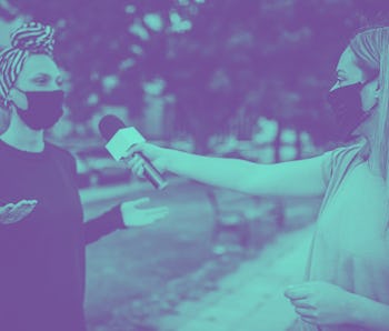 An interview being conducted outside.