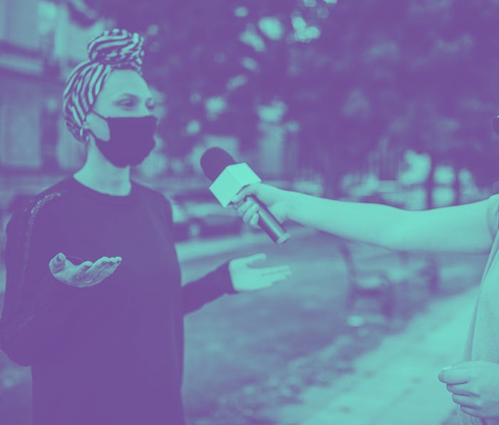 An interview being conducted outside.