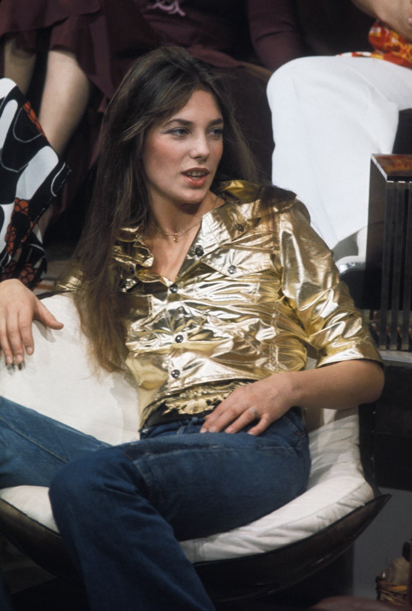 70s denim: Jane Birkin wears a metallic jacket and bootcut jeans in the 1970s.
