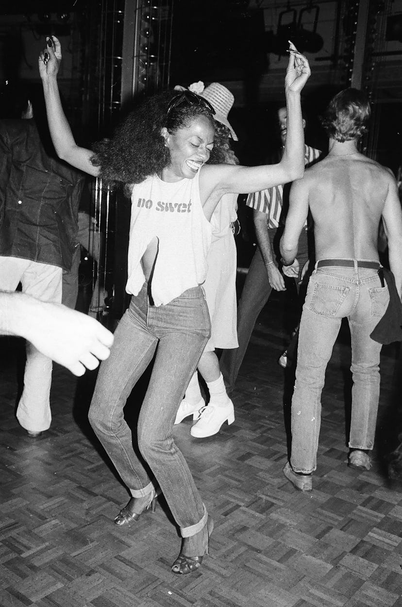 70s denim: Diana Ross wears 'no sweat' ripped tank and flared jeans in the 1970s.