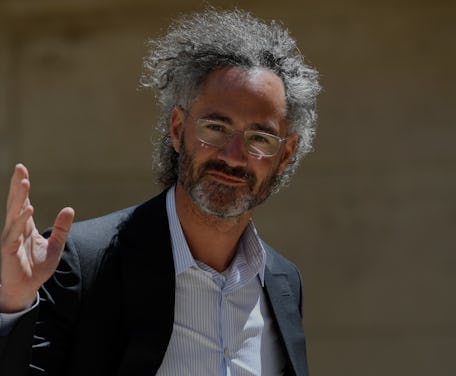 CEO Alex Karp waves to the camera.