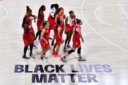 The Atlanta dream crosses the WNBA court with its Black Lives Matter graphic. Elizabeth Williams tel...