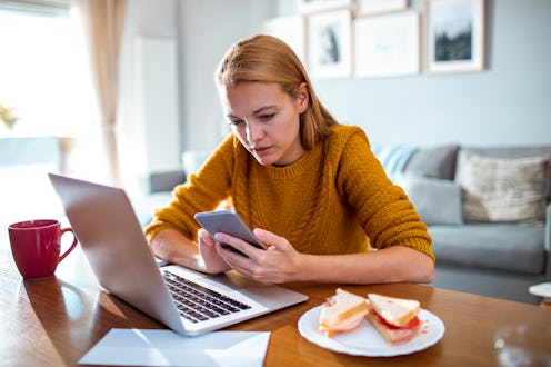 Young woman using an app on her smartphone. This timeline explains what's happening with tiktok righ...