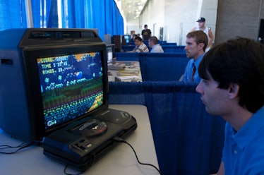 A photo of a boy playing Sonic the Hedgehog on the Sega Genesis.