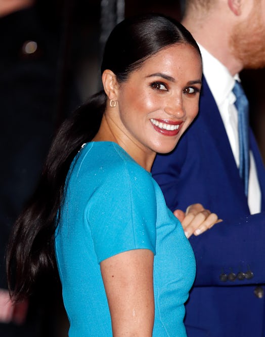 Markle wore a brown smoky eye and red lipstick to The Endeavour Fund Awards.