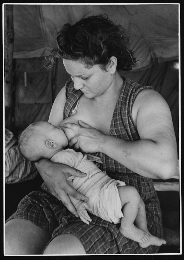1946 black and white vintage photo of woman breastfeeding in Cyprus