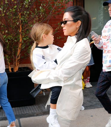 Kourtney Kardashian steps out with Reign Disick.