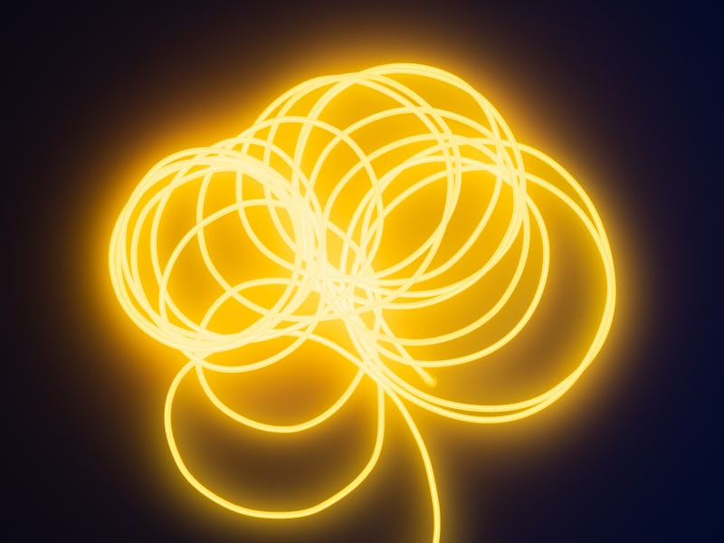 A fluorescent wire can be seen in bright yellow color. It's made up of multiple spirals with its tai...