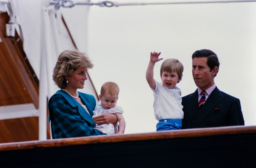 The royal family poses on a boat