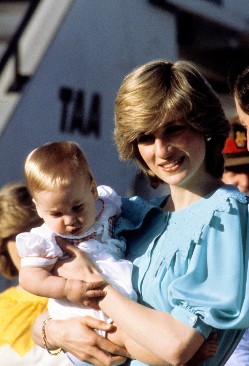 Princess Diana holds a young Prince William