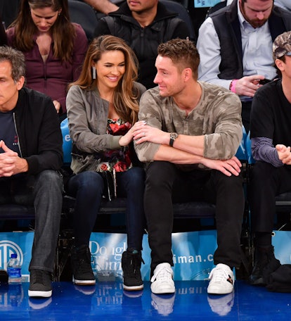 Chrishell Stause and Justin Hartley attend a basketball game.