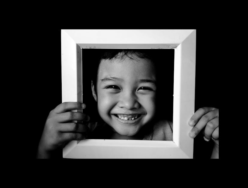 closeup of kid's face in photo frame