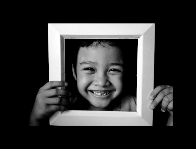 closeup of kid's face in photo frame