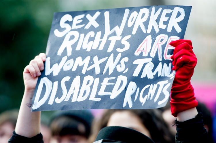 A sign at a protest saying "Sex worker rights are womxns, Trans, disabled rights."