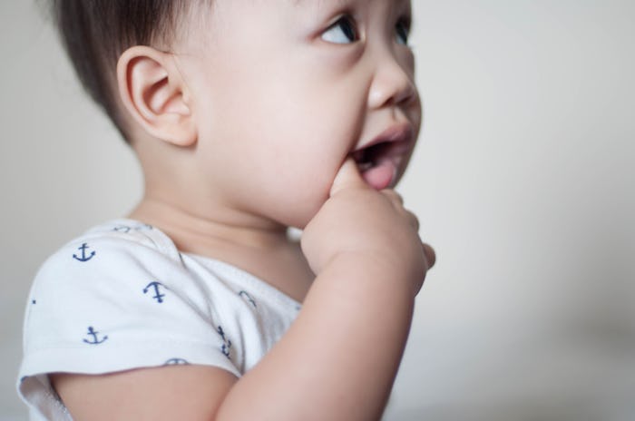 baby chewing on finger