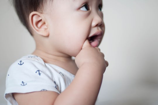 baby chewing on finger