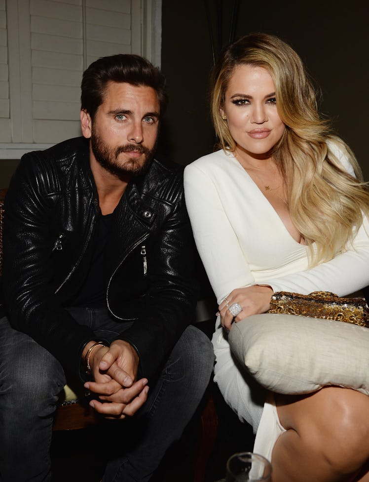 Scott Disick and Khloe Kardashian pose for a photo.