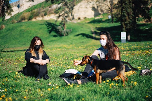 Two women sit in the park at social distance. Three women explain how they made friends during the p...