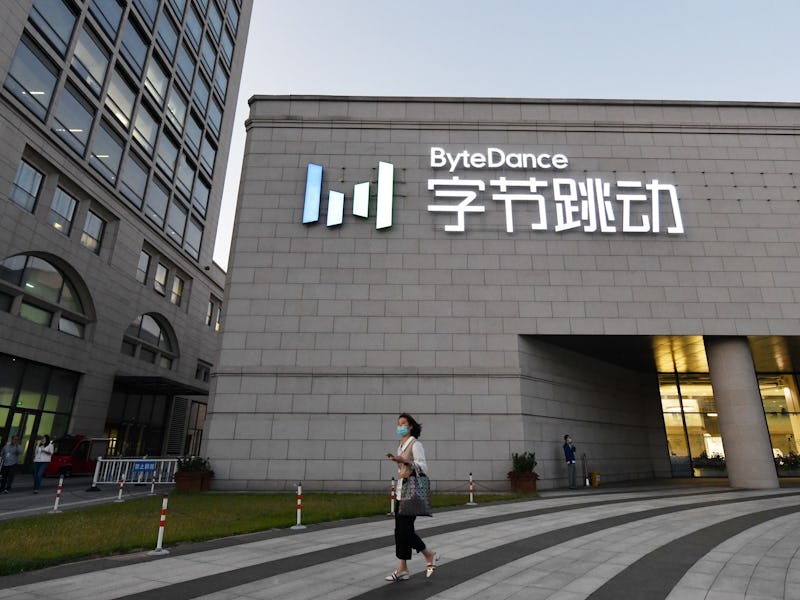 A pedestrian passes by the building of ByteDance, which owns TikTok.