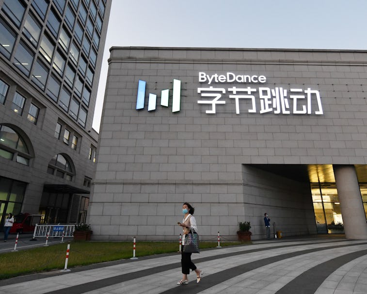 A pedestrian passes by the building of ByteDance, which owns TikTok.