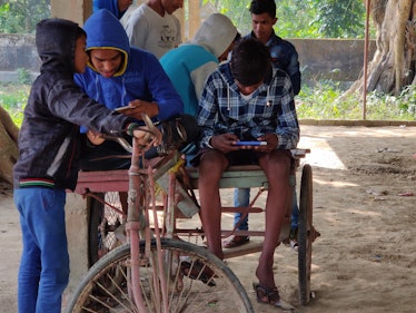 Teens in rural India playing PUBG earlier this year. 