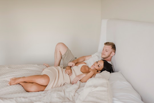 A man and a woman lying on a bed who have a low sex drive