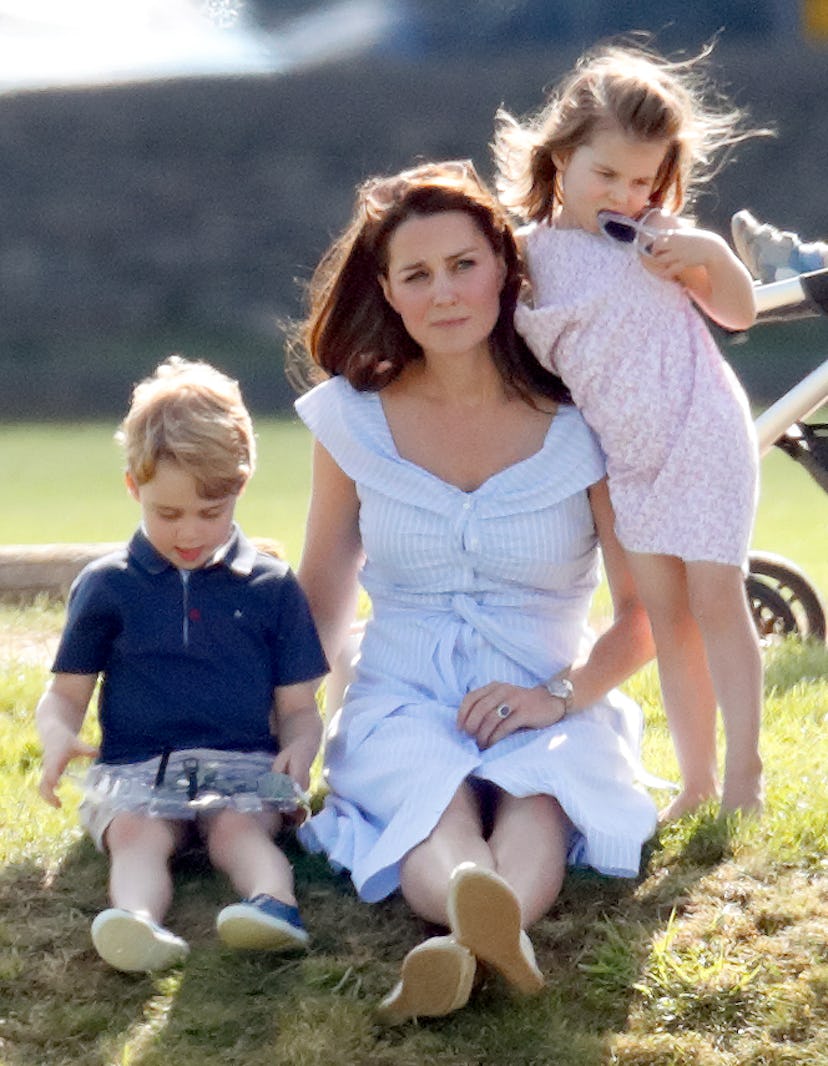 Princess Charlotte leans on her mom.