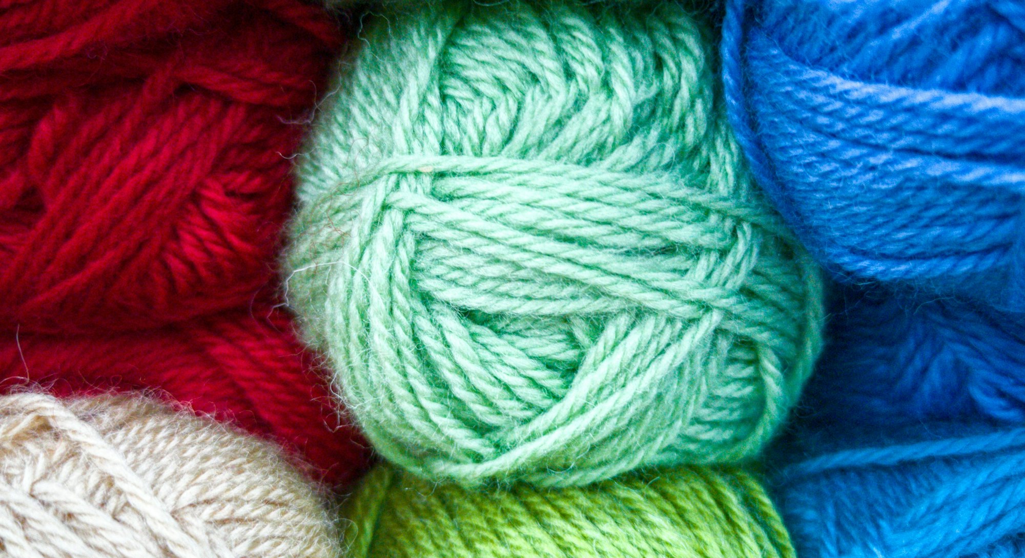 A close up of balls of yarn. This article details pandemic hobbies to do during the winter.