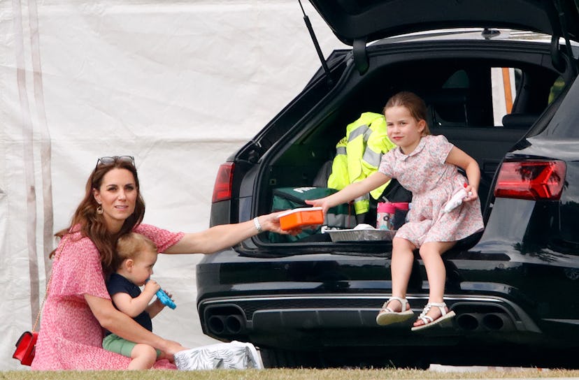 Princess Charlotte gets snacks from her mom.