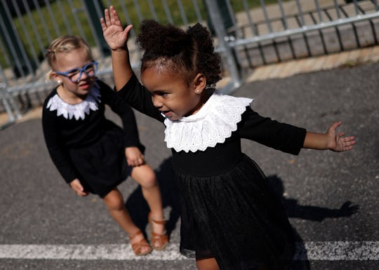 Across social media, parents have paid tribute to Ruth Bader Ginsburg by sharing photos of their chi...