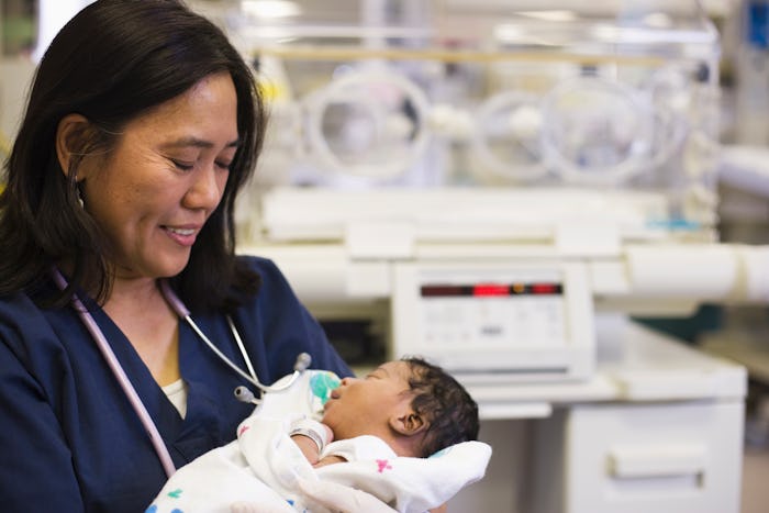 a nicu nurse with a newborn