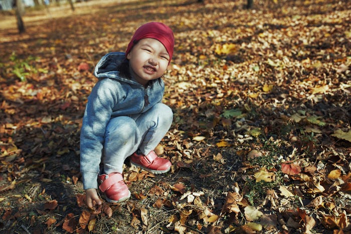 little girl in fall outside