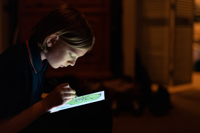 tween on tablet in dark