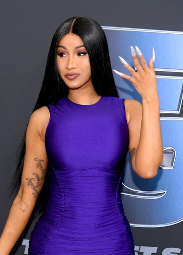 Cardi B hits the red carpet in a royal blue dress.