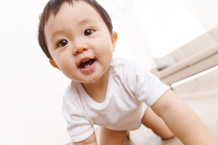 baby boy crawling with drool