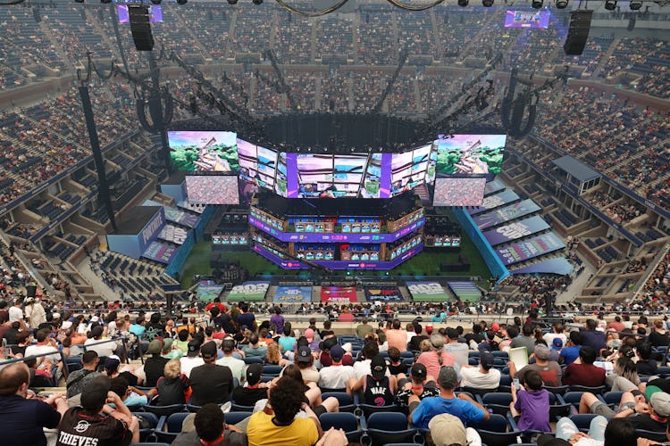 A stadium watching a Fortnite match.