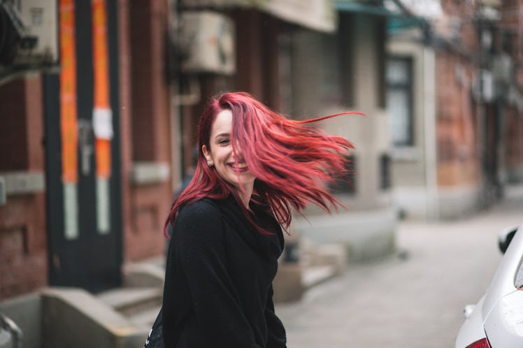 A young woman with purple and pink hair shows off her fall hair color, for which she'll need some In...