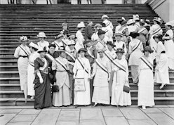 An old black-white photo with suffragettes posing together